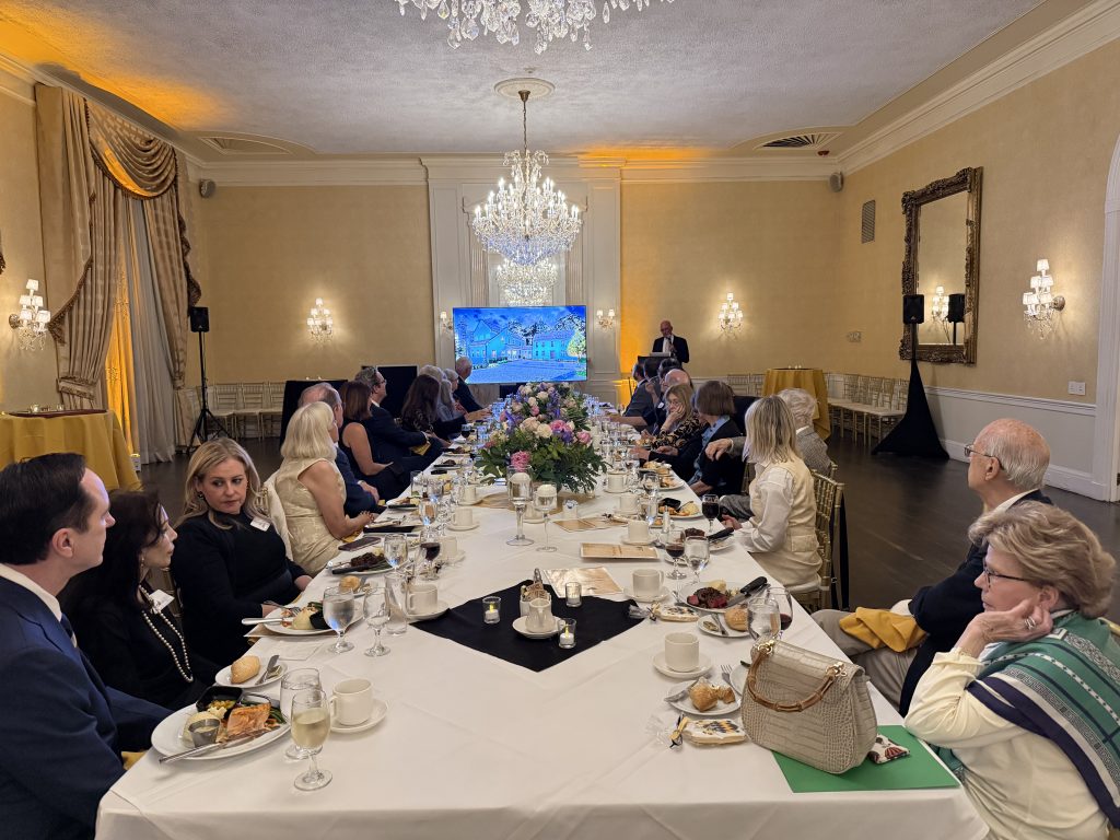 Attendees enjoy a ticketed dinner following the meeting and reception