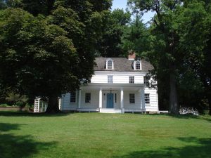 Exterior view of Lloyd Manor, the historic Joseph Lloyd Manor House in Lloyd Harbor, Long Island, a colonial estate built in the 1760s and significant to regional history and Preservation Long Island tours